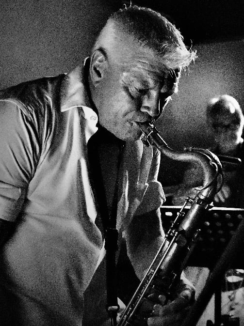Justin on saxophone, playing alongside DJ Taylor on Saturday 12 December